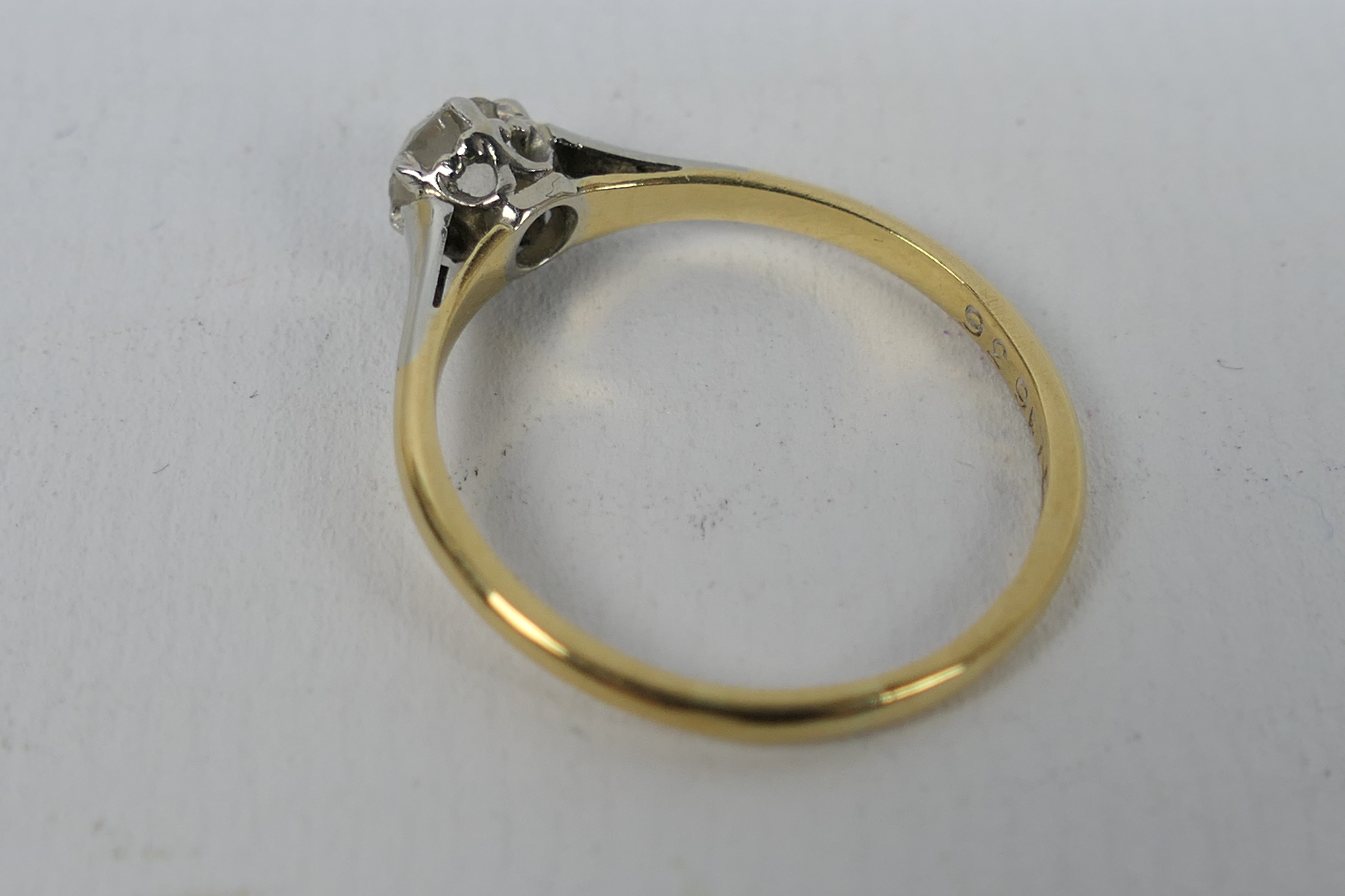 A two-tone, solitaire ring, stamped 18ct, size O, approximately 2.2 grams all in. - Image 3 of 4