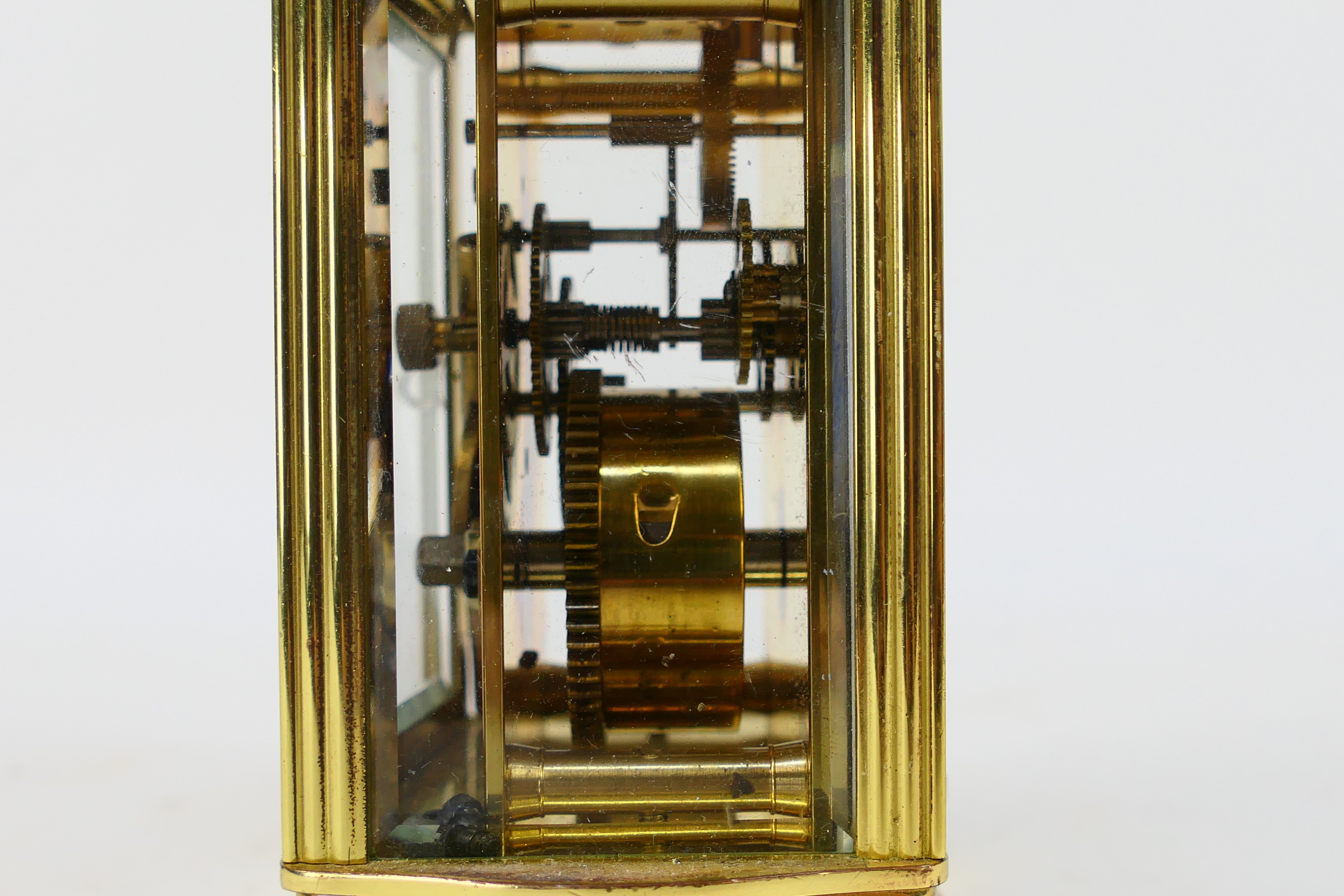 A brass and glass cased carriage clock, Roman numerals to a white dial, the dial signed Imperial, - Image 4 of 7