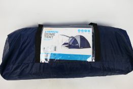 A four person dome tent contained in carry case.