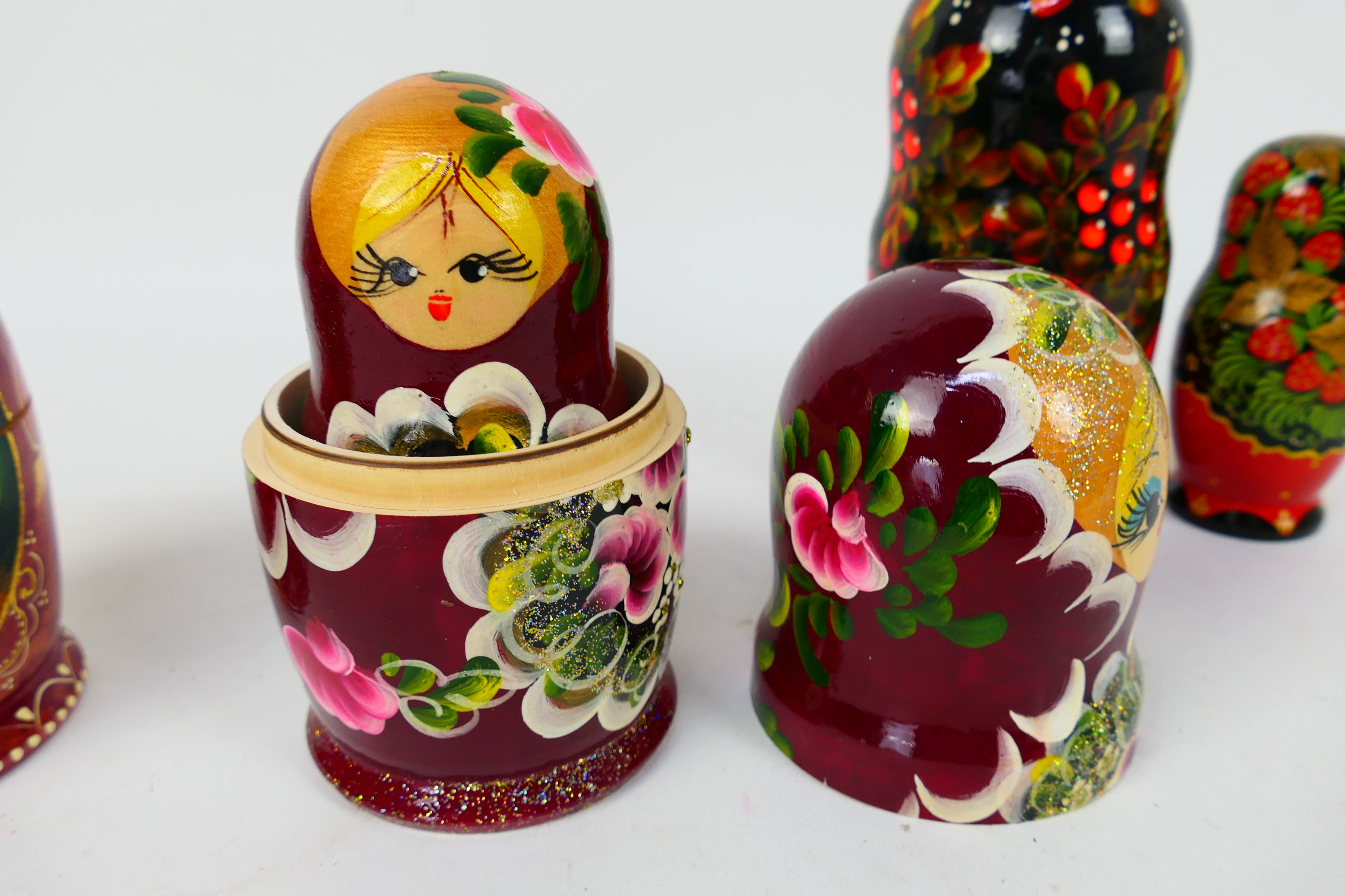 Four sets of Russian matryoshka nesting dolls, largest approximately 17 cm (h). - Image 3 of 3