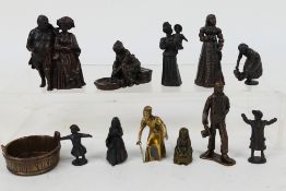 A collection of bronze figures to include Victorian style, servants, children and similar,