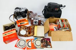 A vintage View-Master viewer contained in original box with a large quantity of discs,