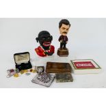 Lot to include a vintage cast iron money bank (reproduction), a bobblehead model of Ron Swanson,