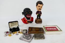 Lot to include a vintage cast iron money bank (reproduction), a bobblehead model of Ron Swanson,