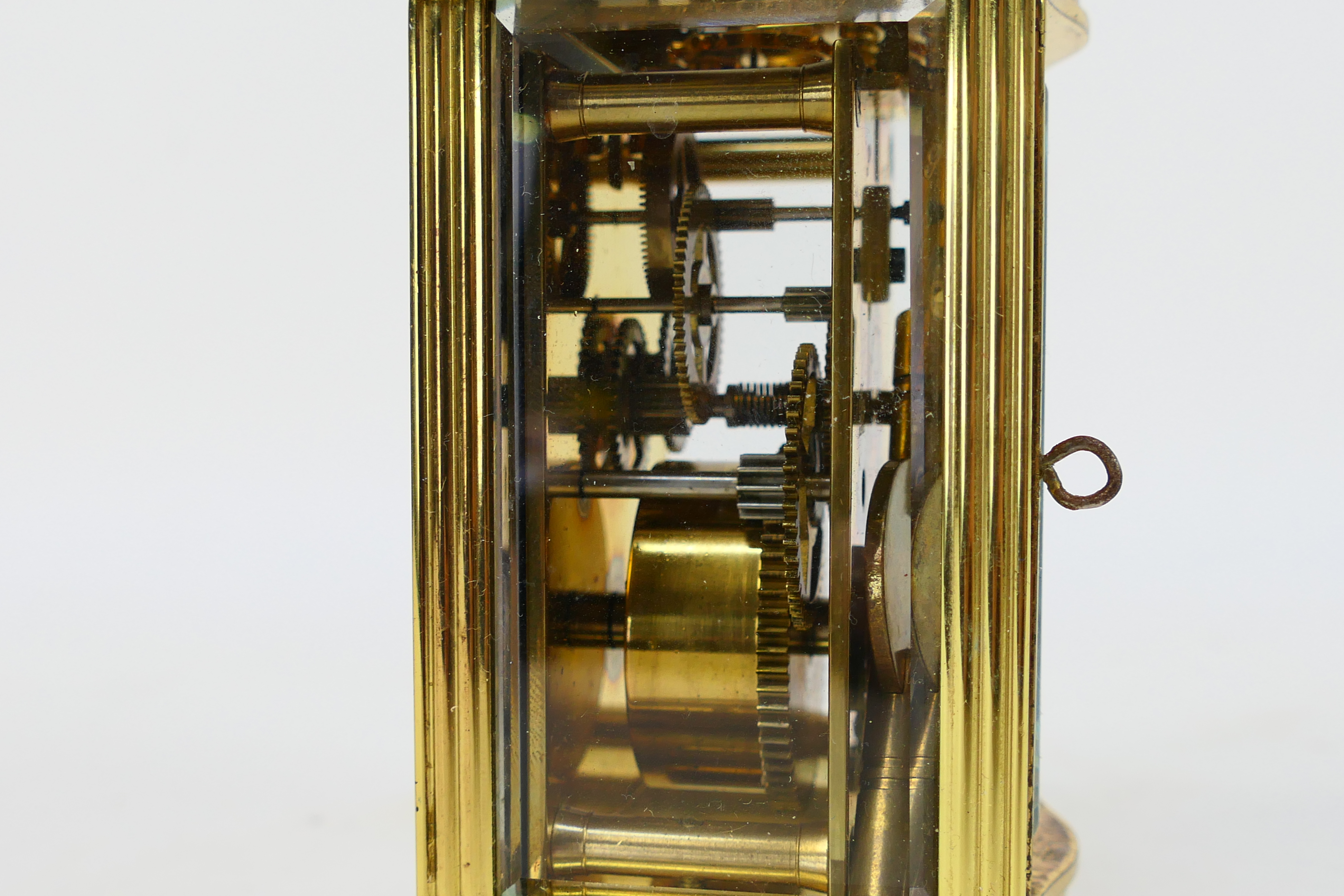 A brass and glass cased carriage clock, Roman numerals to a white dial, the dial signed Imperial, - Image 6 of 7