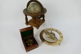 A brass compass marked Nauticalia London contained in wooden case,