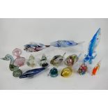 A collection of glassware to include Murano style fish, paperweights, Murano bird,