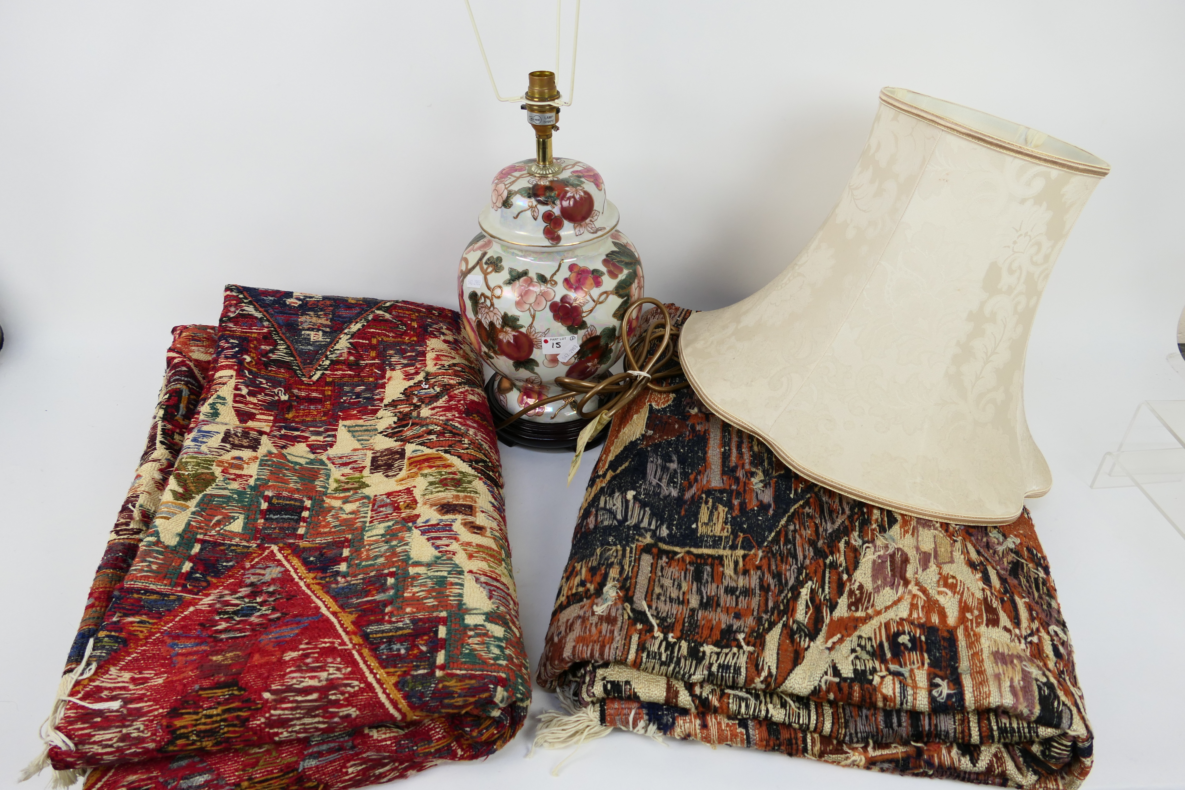 A ginger jar table lamp, two Turkish carpets, approximately 210 cm x 130 cm.