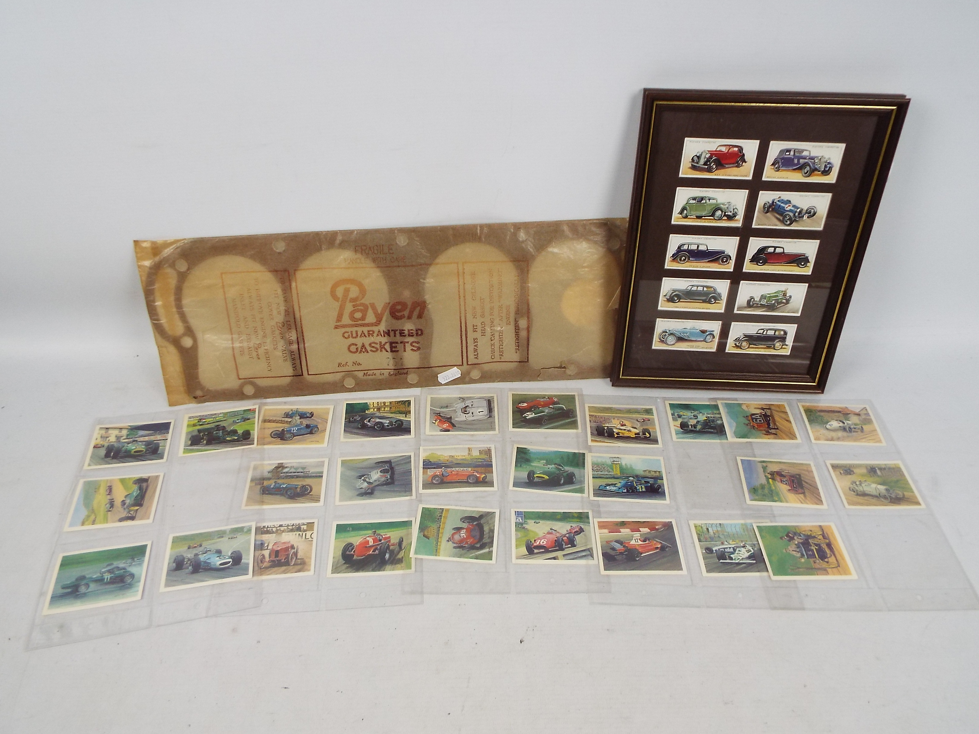 A framed cigarette card display of motor