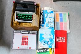 A Lilliput Mark IV typewriter contained in shipping crate,