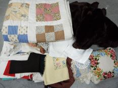 Various vintage linen / fabrics, a fur coat and other.