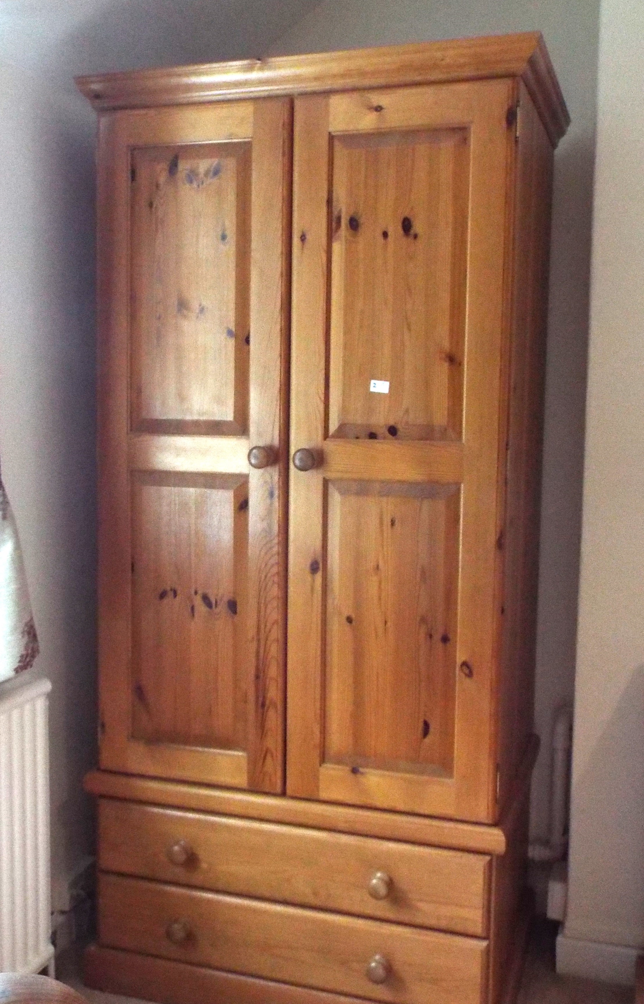 A pine wardrobe measuring 190 cm (h) x 9