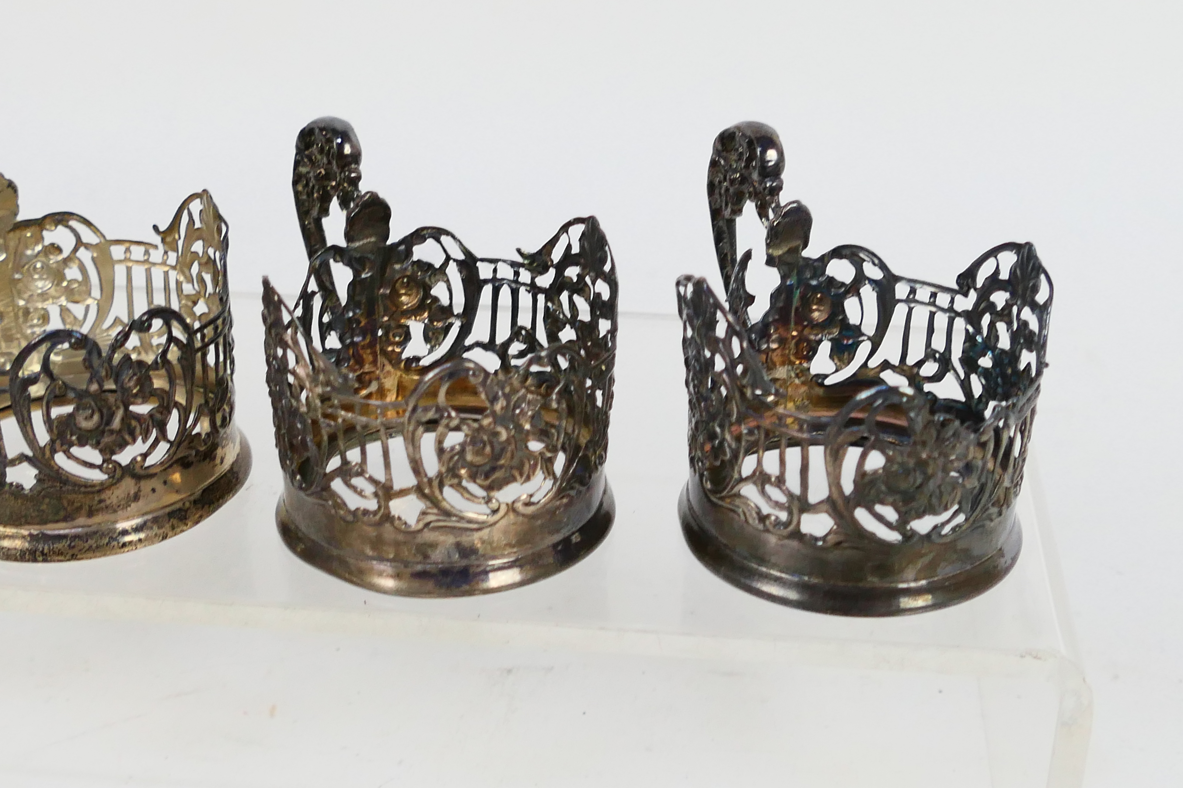 Four Edwardian silver coffee can holders with scrolling floral decoration, - Image 3 of 4