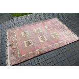 A large rug with animal decoration to include elephant, camel and other,