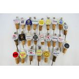 A collection of vintage branded ceramic bottle / spirit pourers to include Wade,