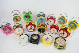 A collection of vintage alarm clocks to include Mickey Mouse, The Flintstones and similar.
