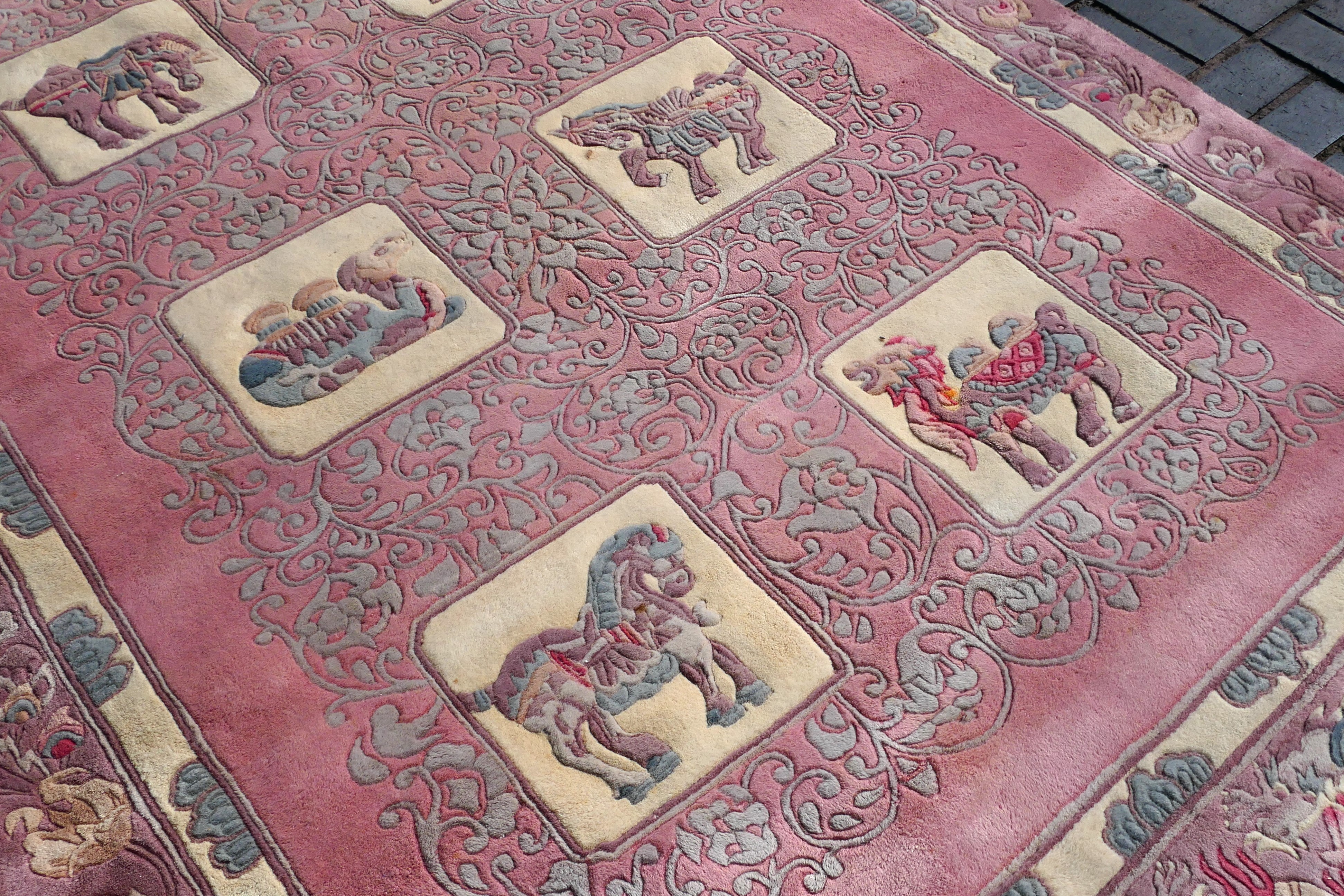 A large rug with animal decoration to include elephant, camel and other, - Image 6 of 7