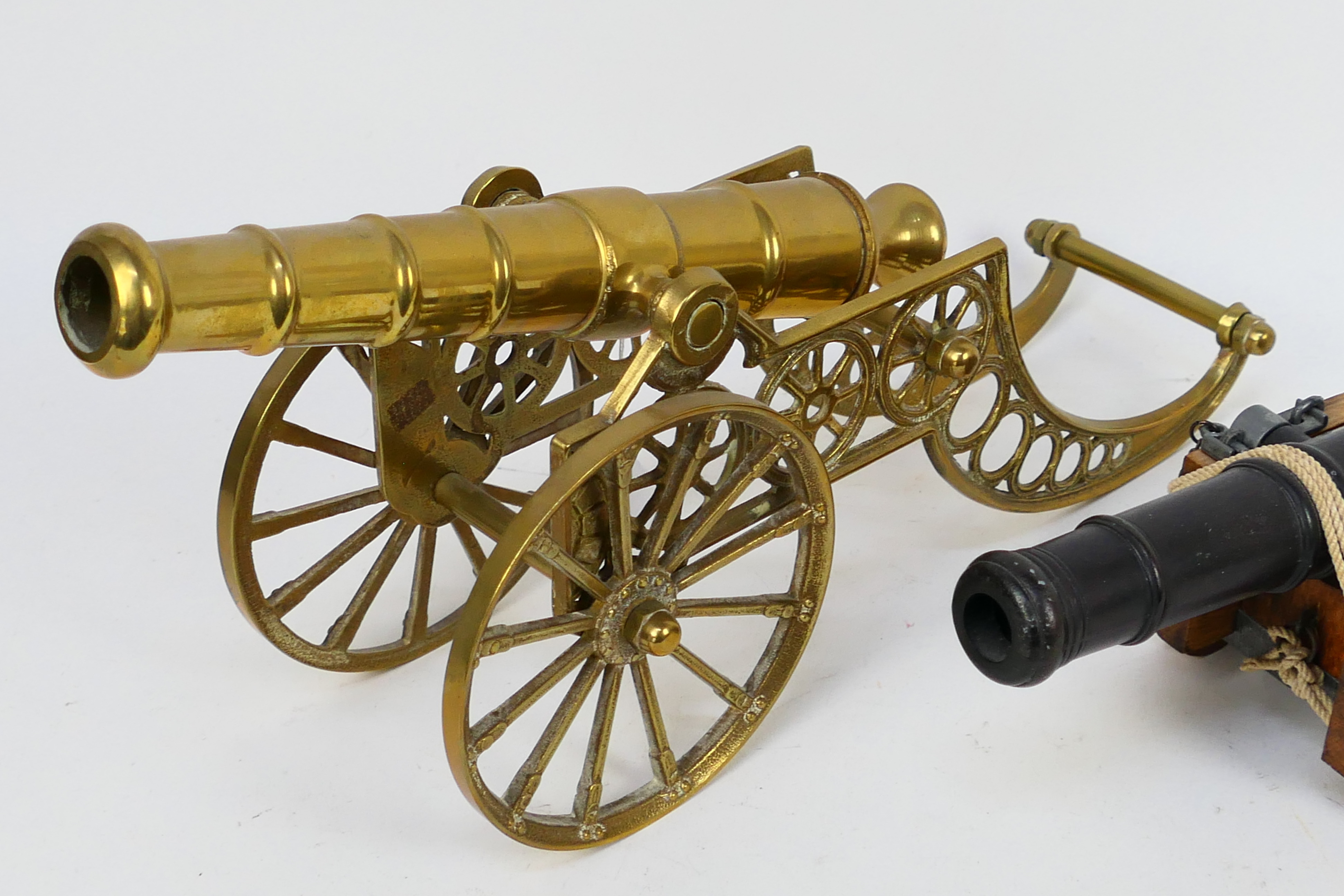 A model canon on wooden carriage and a brass example, largest 42 cm (l). [2]. - Image 3 of 3