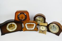 A quantity of mantel clocks to include Smiths, Bentima and other.