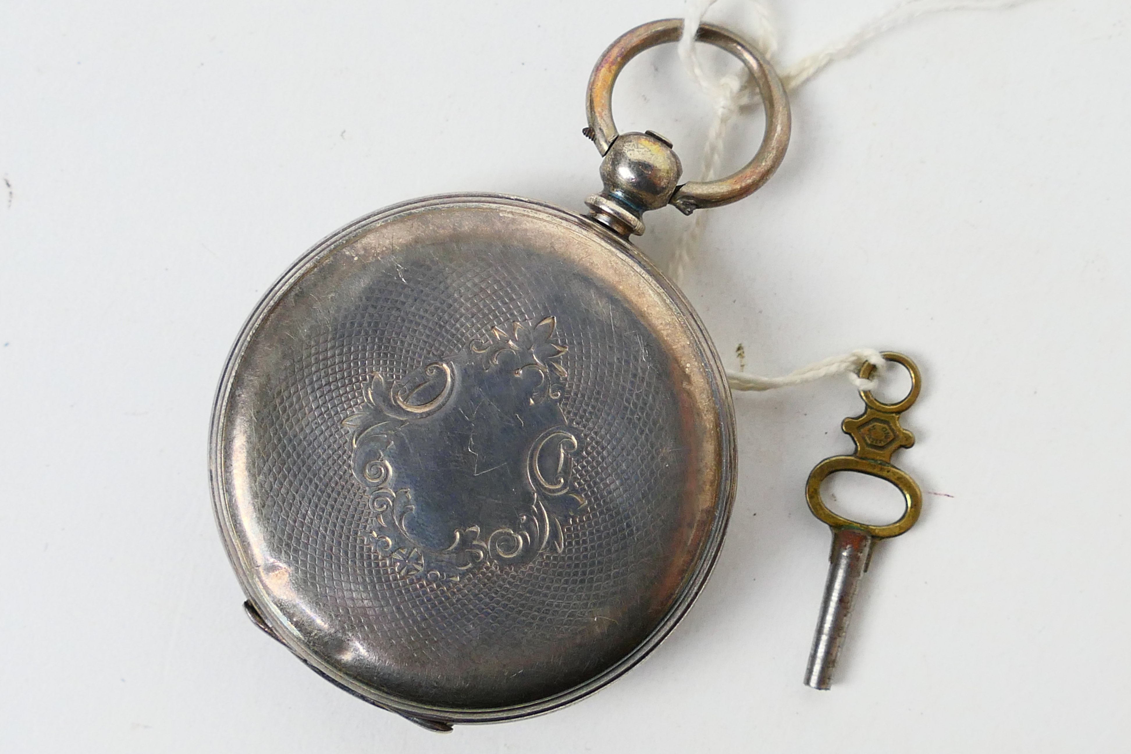 A Swiss silver (935 fineness) cased open face pocket watch, Roman numerals to a white enamel dial, - Image 3 of 6