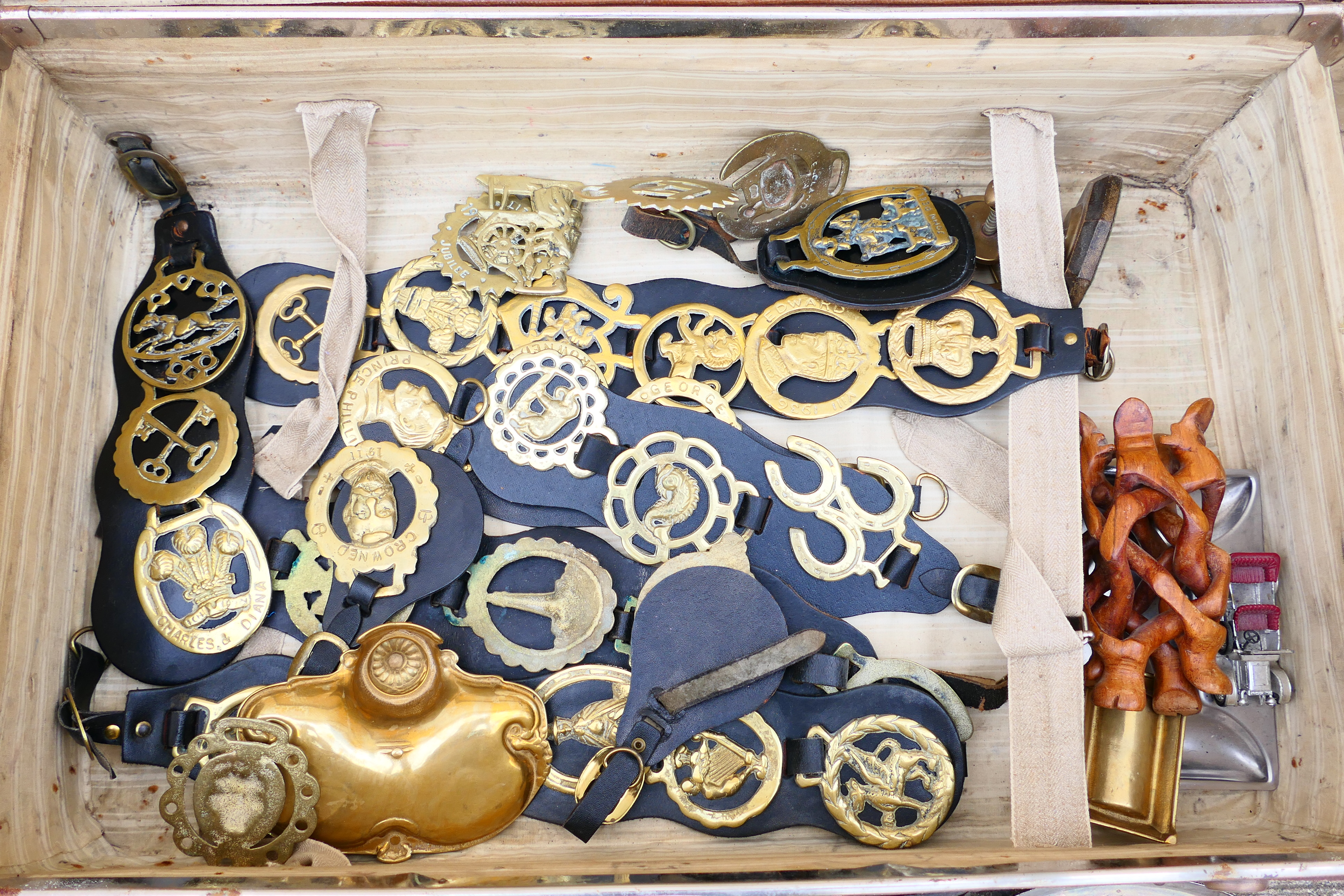 A vintage suitcase containing a quantity of various horse brasses, ships wheel nutcracker, - Image 3 of 6