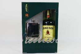 A Jameson Irish Whiskey gift set comprising a 1 litre bottle of Jameson Triple Distilled and a hip