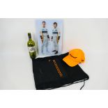 Formula One - A McLaren branded bag and cap and a signed piece of wall art displaying the McLaren