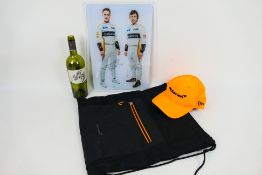 Formula One - A McLaren branded bag and cap and a signed piece of wall art displaying the McLaren