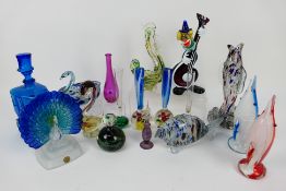 A collection of glass fish, clown, paper