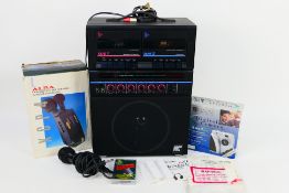 A vintage Realistic Twin Cassette Karaoke System, contained in shipping box,