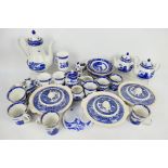 A quantity of blue and white dinner and tea wares, predominantly Wade Willow pattern for Ringtons.