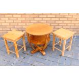 A wooden Table and two wooden Stools appearing in Excellent condition.