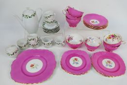 A part tea service with floral decoration and a coffee service.