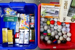 A quantity of golf balls and other golfing accessories, part boxed. [2]. [W].