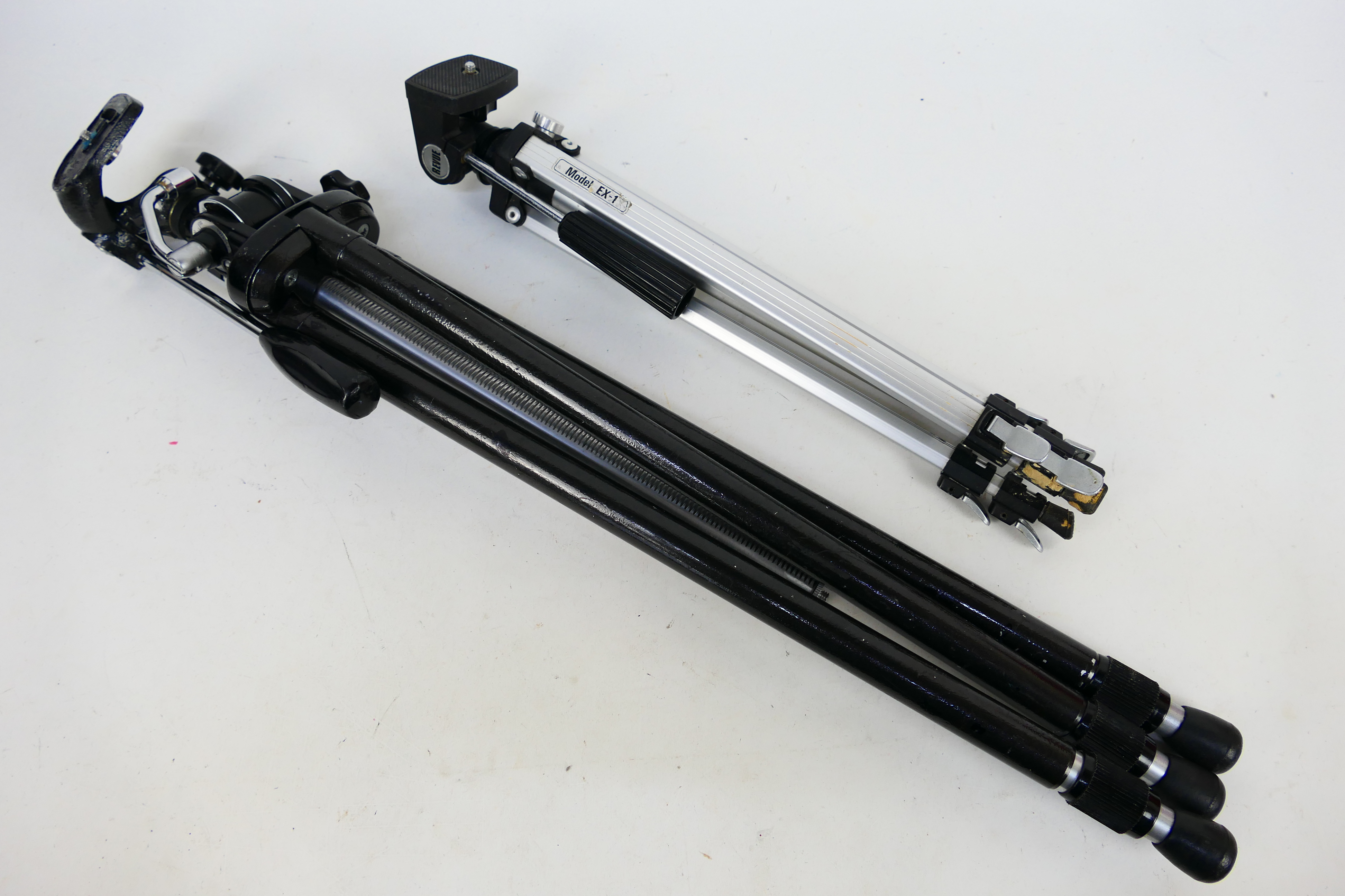 Velbon - Revue. Two Camera tripods appearing in Used yet Excellent condition with telescopic legs.