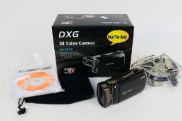 A boxed DXG 3D Video Camera, appears unused.