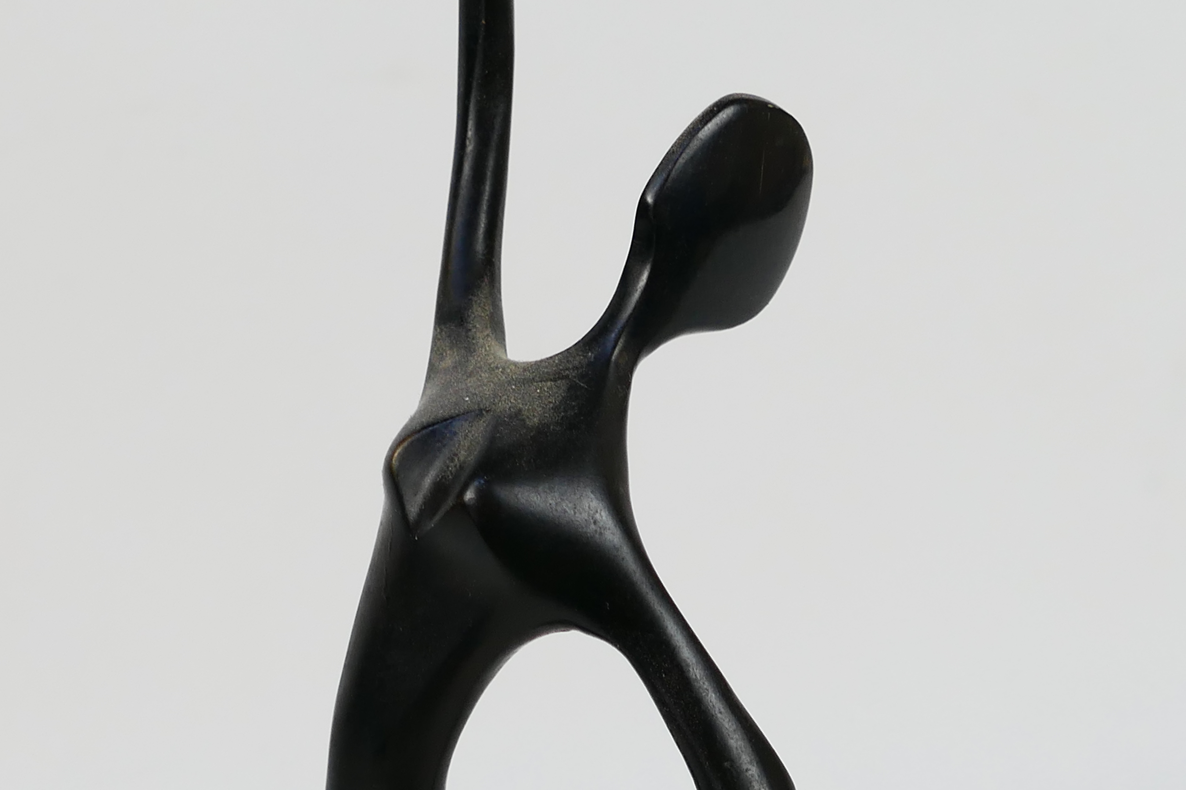 A modern bronze sculpture depicting a stylised, slender female figure 32.5 cm (h). - Image 3 of 4