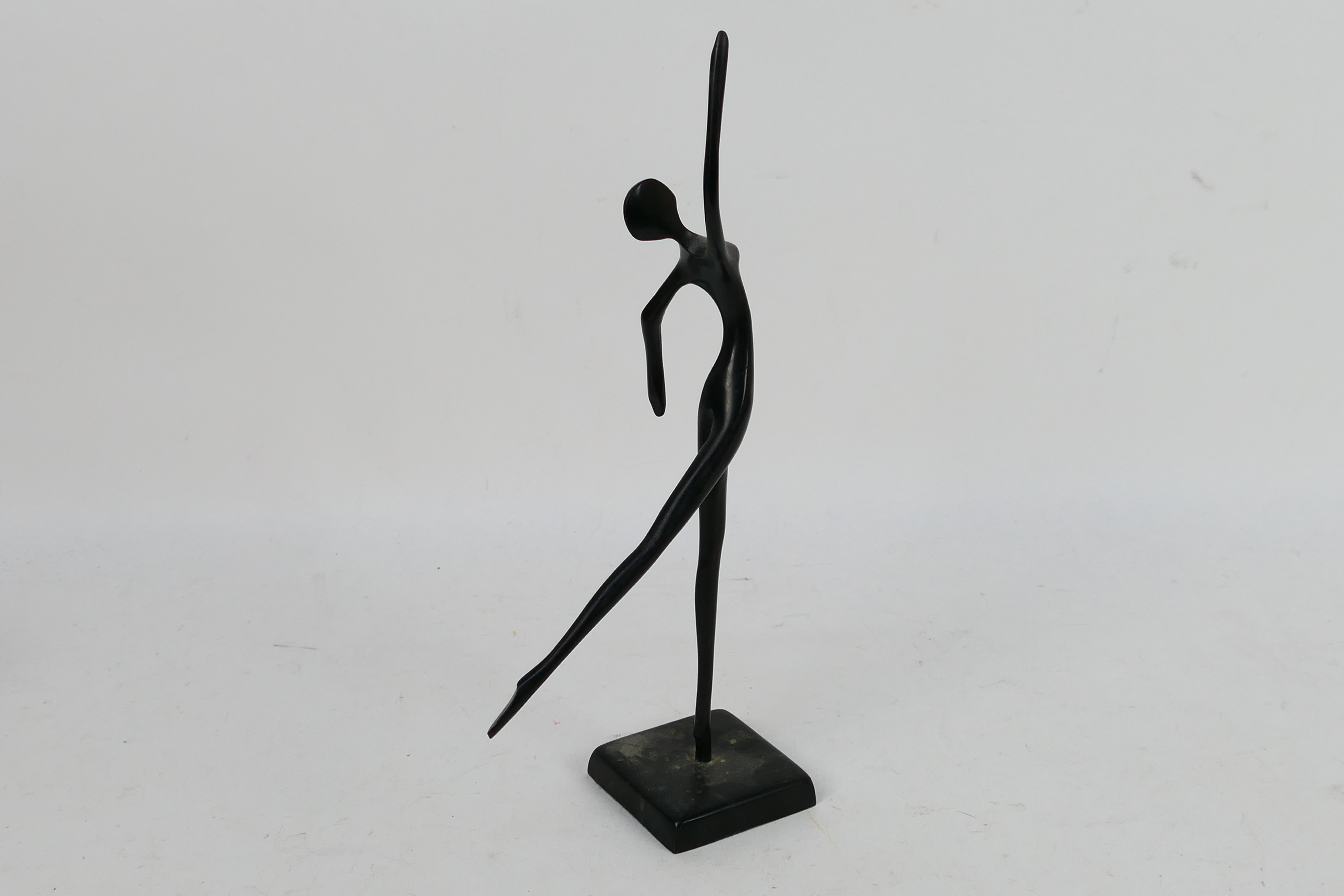A modern bronze sculpture depicting a stylised, slender female figure 32.5 cm (h). - Image 4 of 4