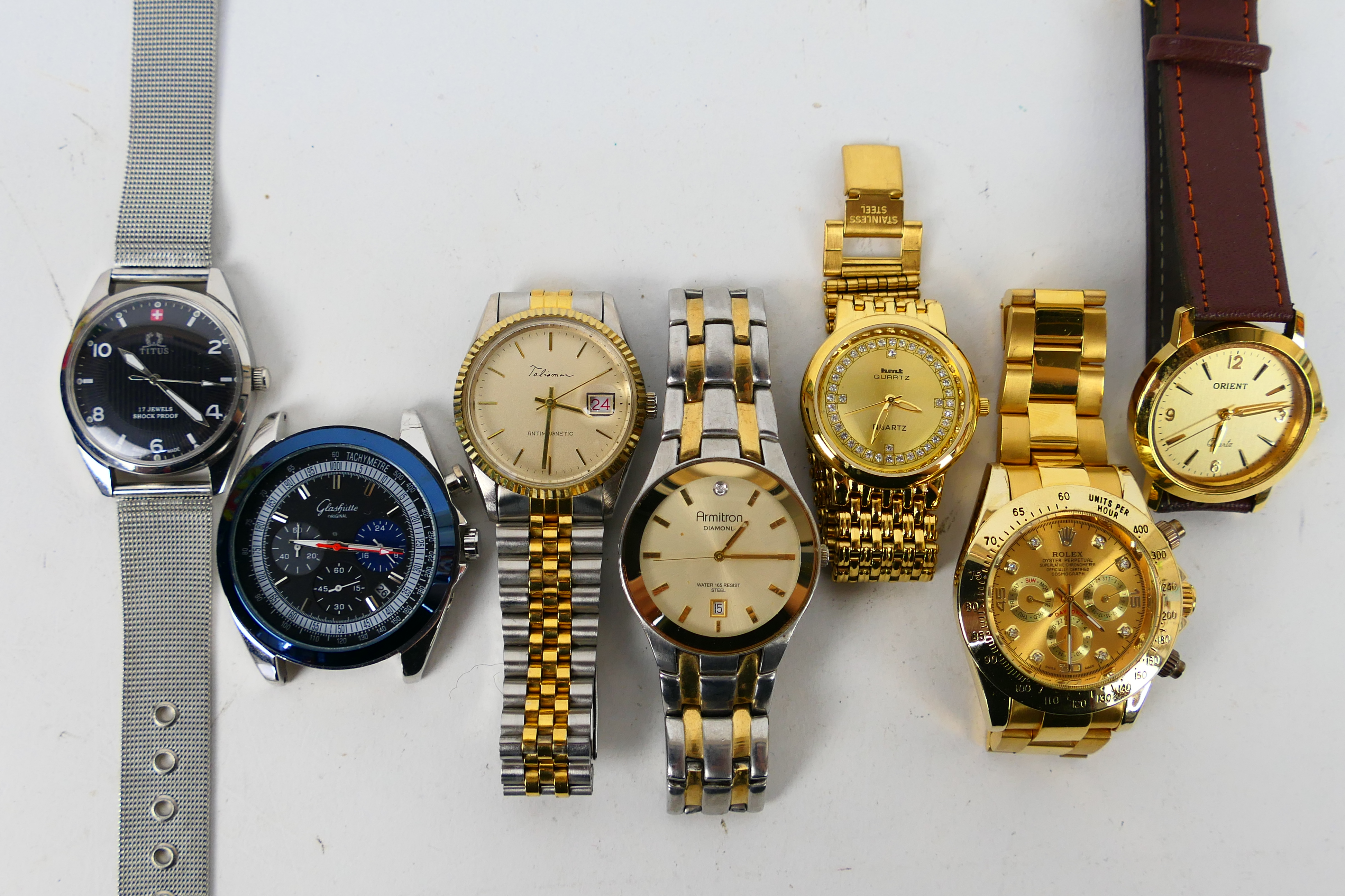 A quantity of wrist watches to include Titus, Orient, Armitron, HMT and other.