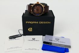 A boxed Pagani Design automatic wrist watch on leather strap, with paperwork.