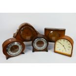 A quantity of mantel clocks.