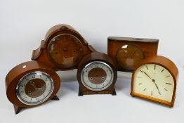 A quantity of mantel clocks.