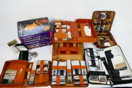 A quantity of gentleman's travel grooming kits, publications relating to British monarchs and other.