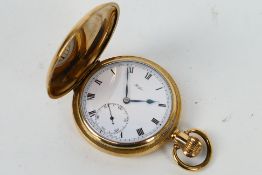A gold plated full hunter pocket watch, Roman numerals to a white enamel dial,