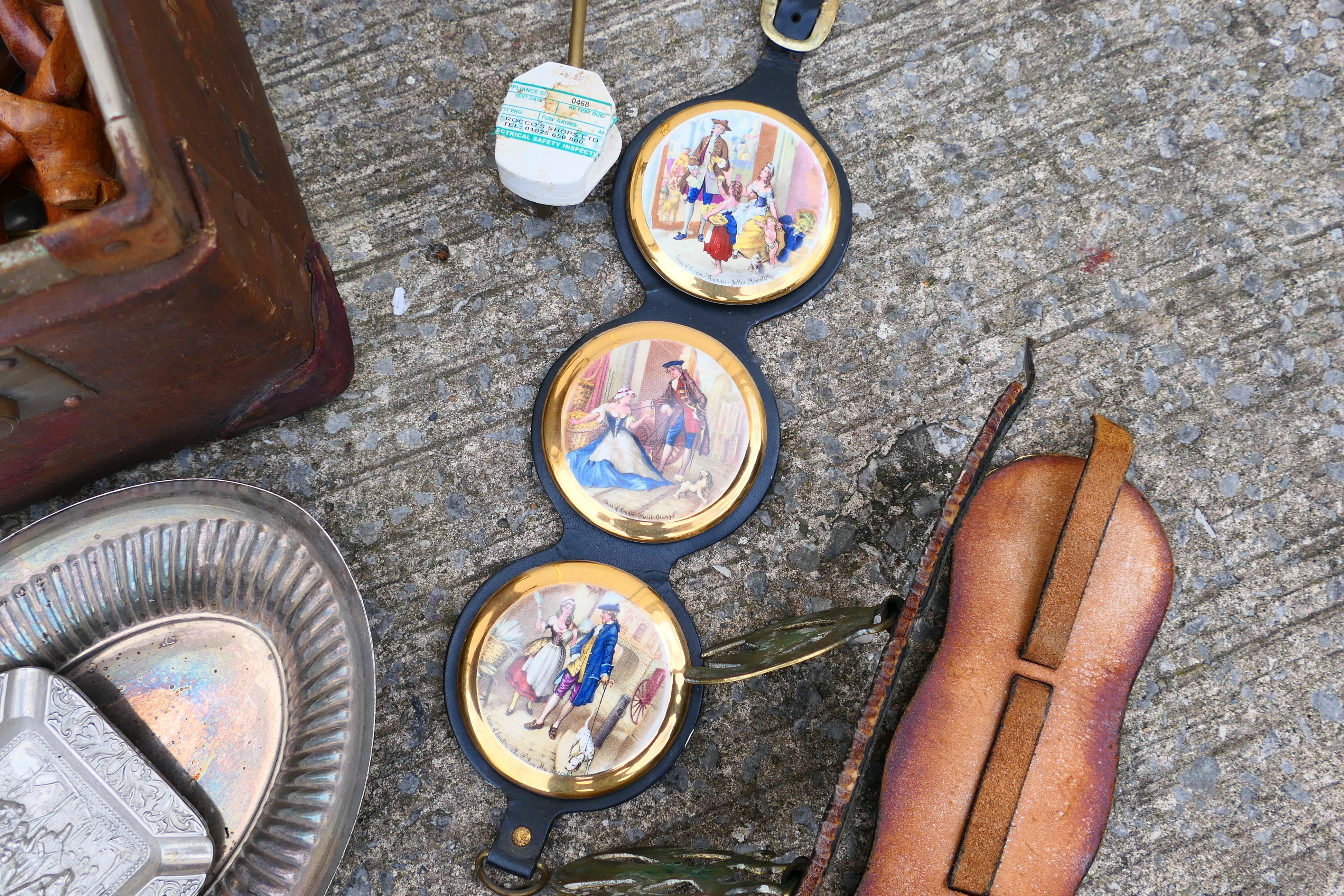 A vintage suitcase containing a quantity of various horse brasses, ships wheel nutcracker, - Image 6 of 6