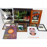 A group of advertising pieces, mirrors and signs to include Coca Cola, Strongbow,