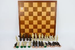 A chess set with Roman style pieces, king approximately 10 cm (h).