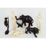 Lot to include wooden carvings comprising elephant, lion and other,