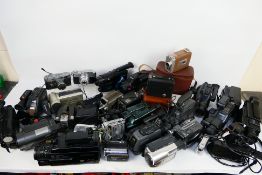A large quantity of vintage camcorders and a small quantity of cameras to include a Canon 3CCD