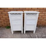 A pair of white vintage style wooden bedside cabinets,